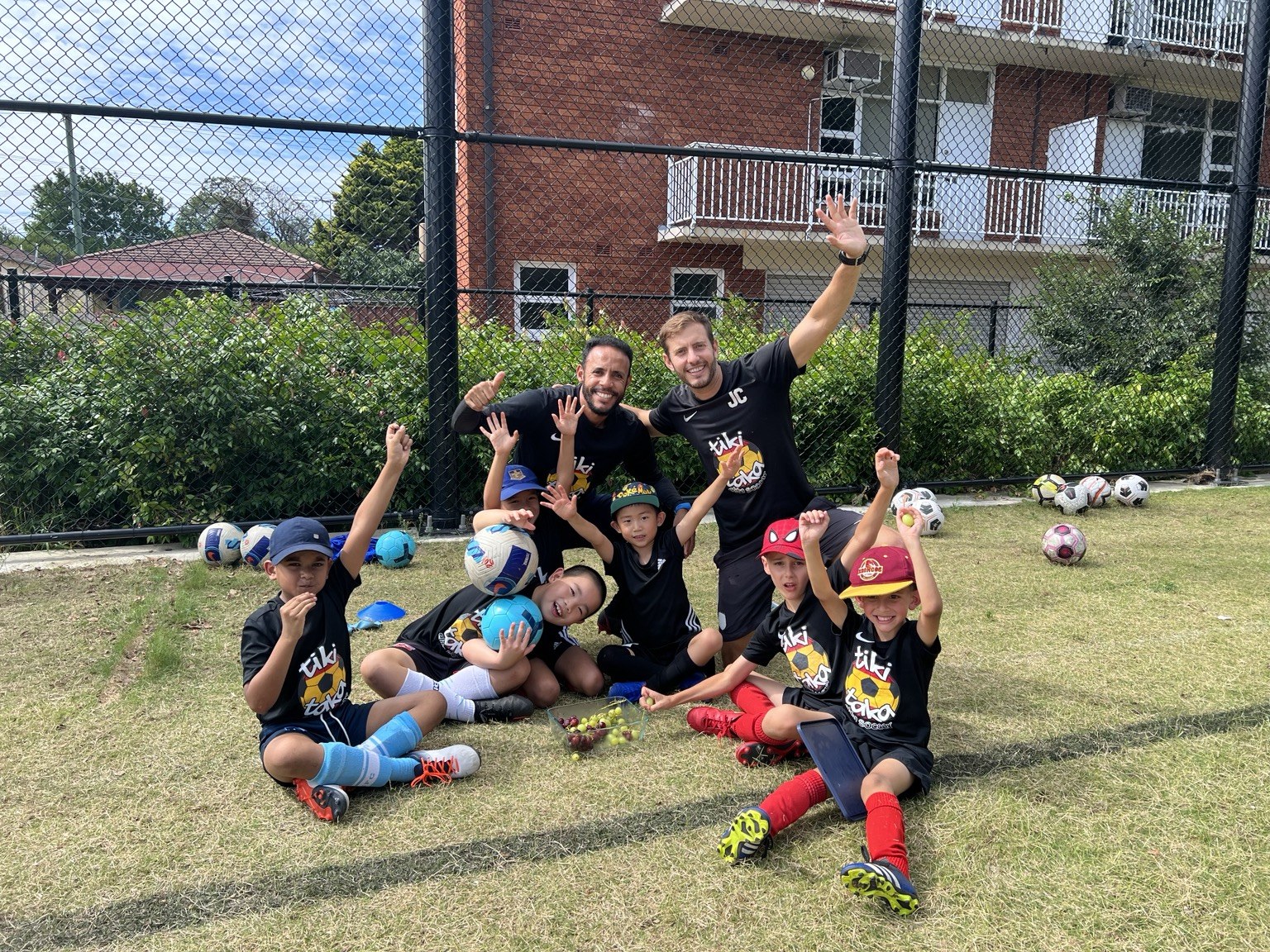 Tiki Taka coaches and young players enjoying a day of football together
